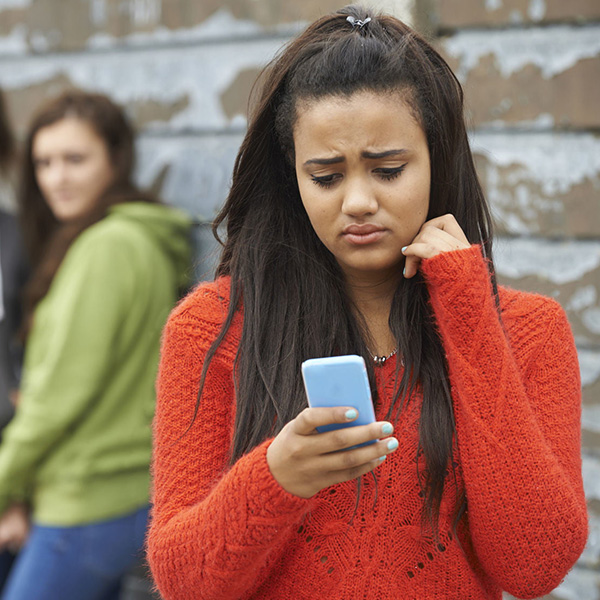 Teenage Girl Being Bullied By Text Message